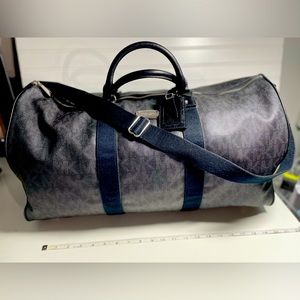 Black Michael Kors overnight travel bag